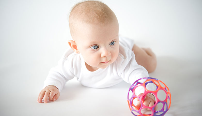 Baby Crawling playing with a ball | Ontario Early Years Centre | Baby Bytes | Simcoe Community Services