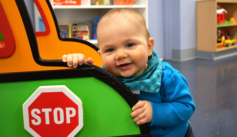 Baby Smiling at camers | Ontario Early Year Centre | Simcoe Community Services