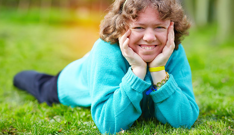 smiling on grass