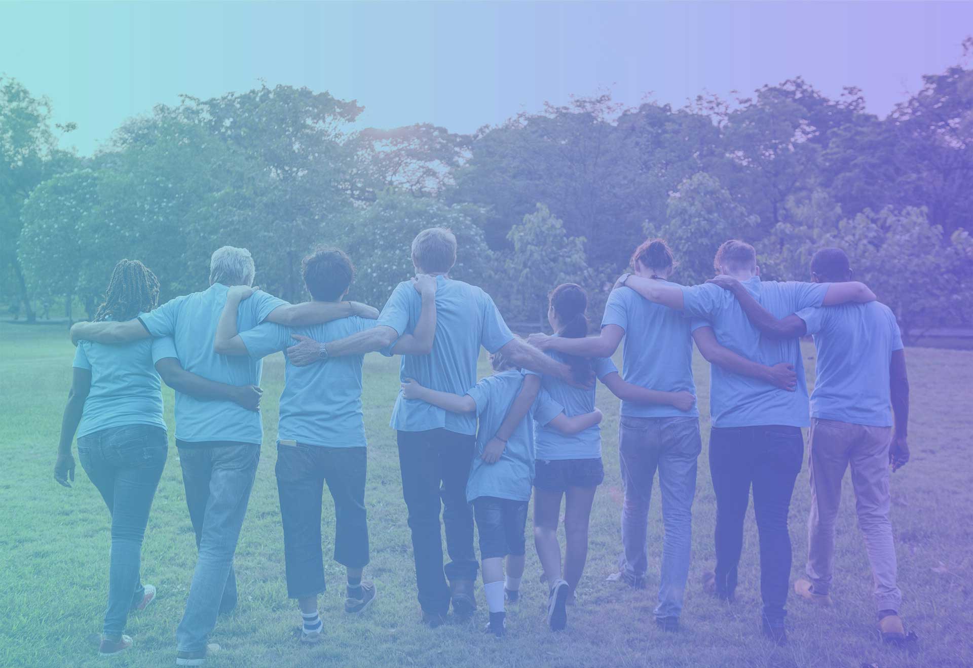 Group in blue shirts walking together | What's New? | Simcoe Community Services