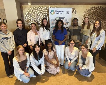 Empower Simcoe's Summer Students standing with CEP Claudine Cousins