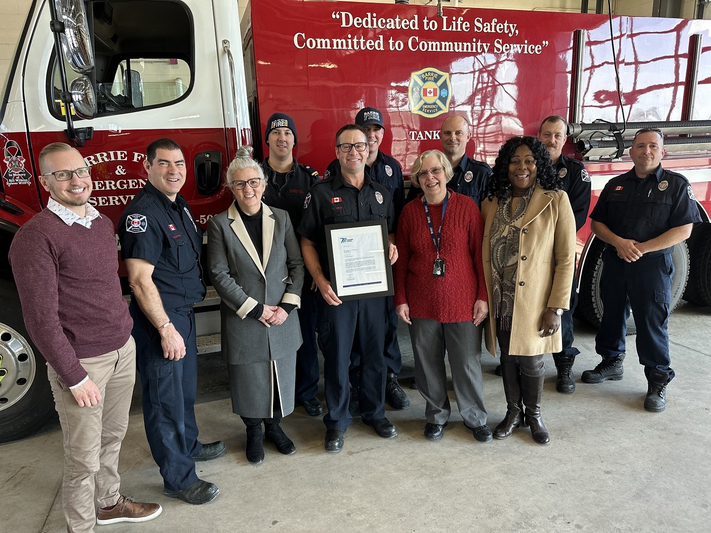 posing in front of fire truck