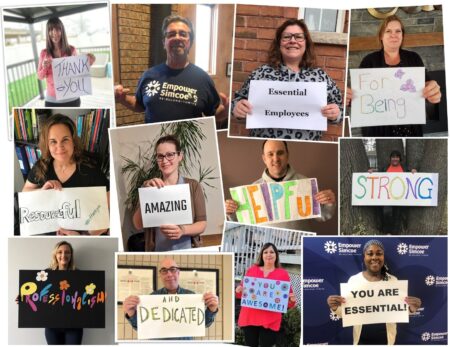 staff holding signs of appreciation