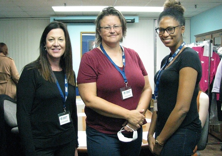 three people smiling
