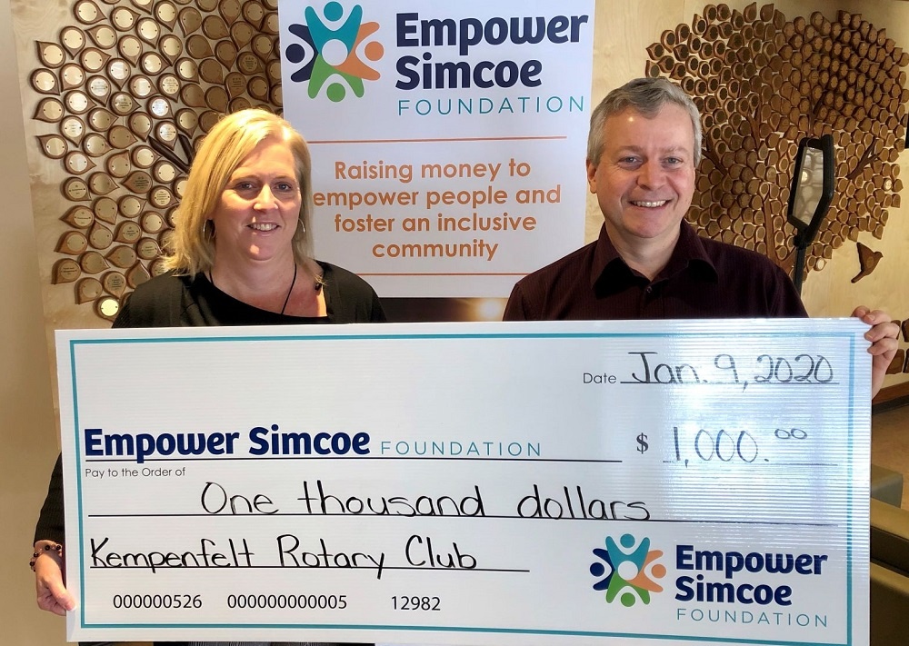 Kempenfelt Rotary Club Barrie holding up large donation cheque