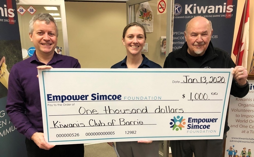 Barrie Kiwanis Holding Up Large donation cheque