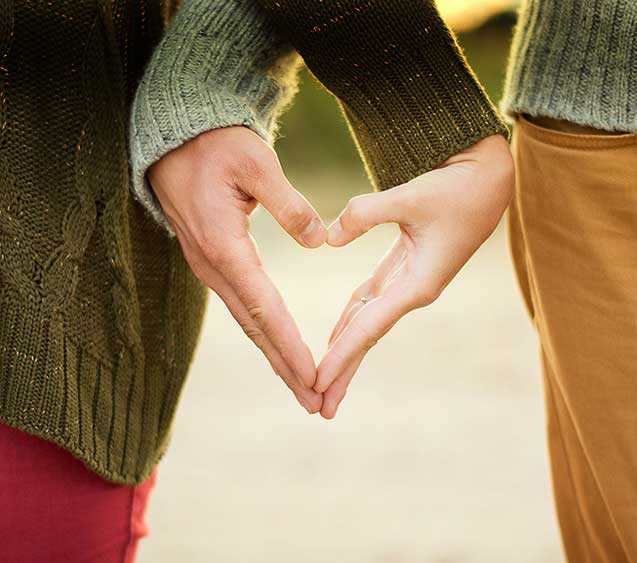 Hands together forming heart